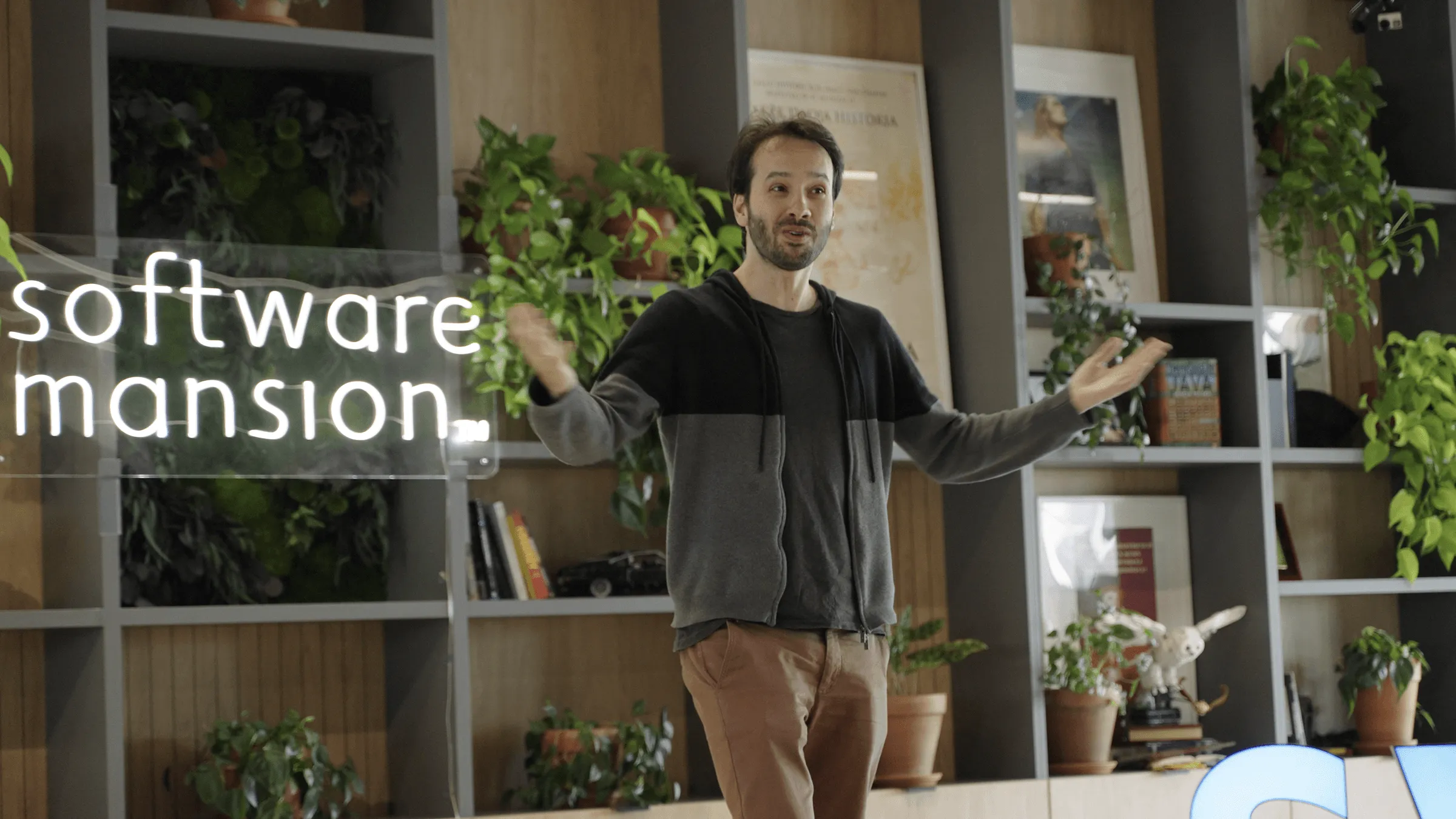 Person speaking in the Software Mansion office during an event